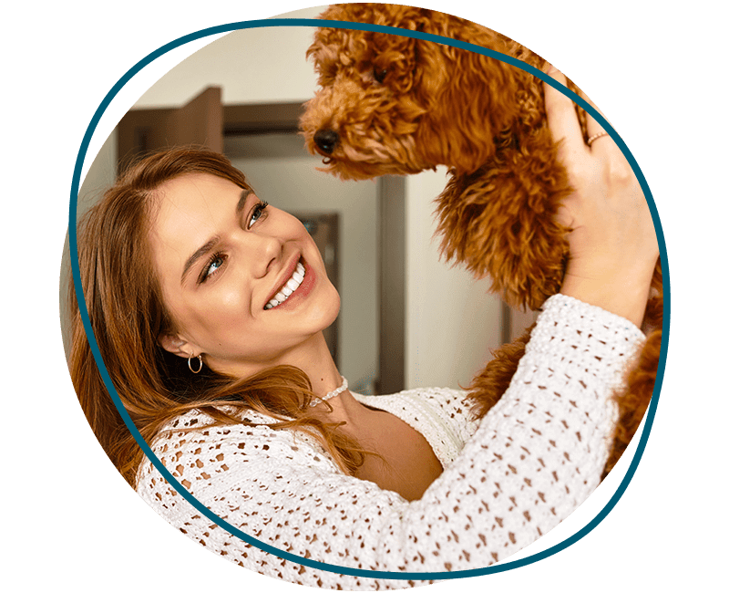 woman enjoys joyful moment with dog