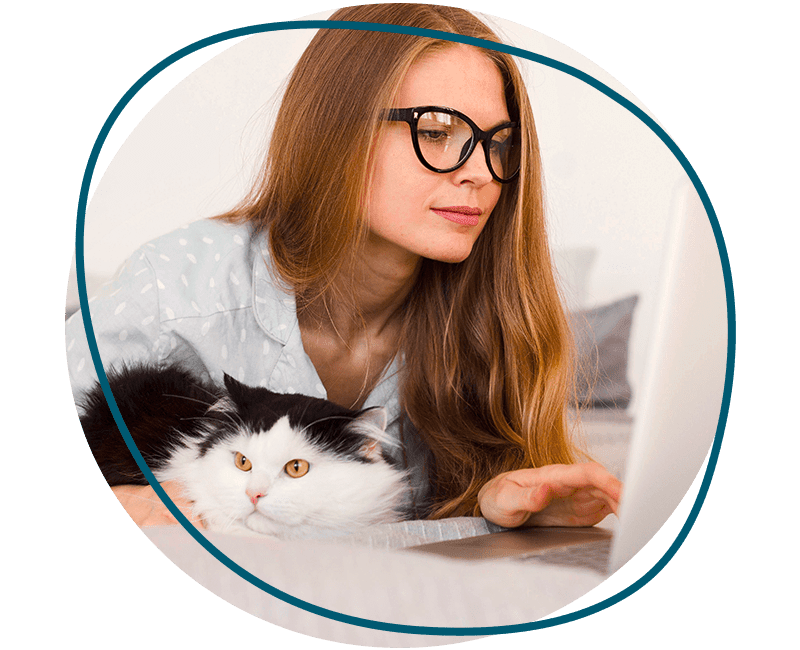 woman working laptop from home with cat